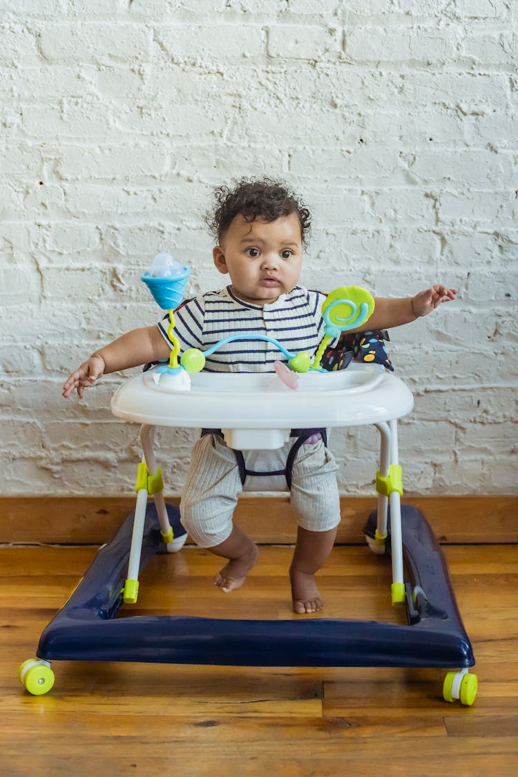 Little Black Toddler In Baby Walker