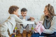 Content mother with black kids at home