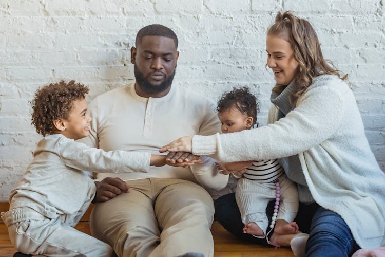 Cheerful Multiethnic Family Playing In Room