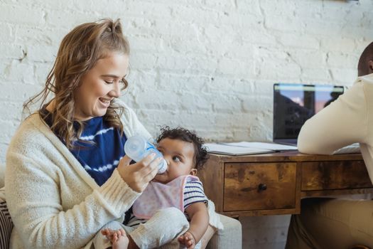 Woman Feeding a Baby