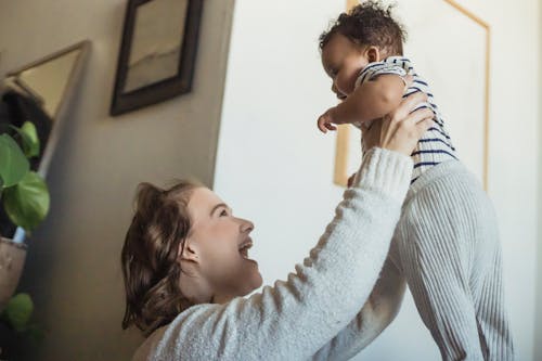 Free Mother Lifting Her Baby Up  Stock Photo