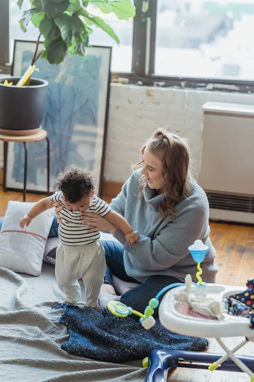 Free Mother Playing with Her Baby Stock Photo