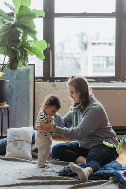 Free Mother Playing with Her Baby Stock Photo