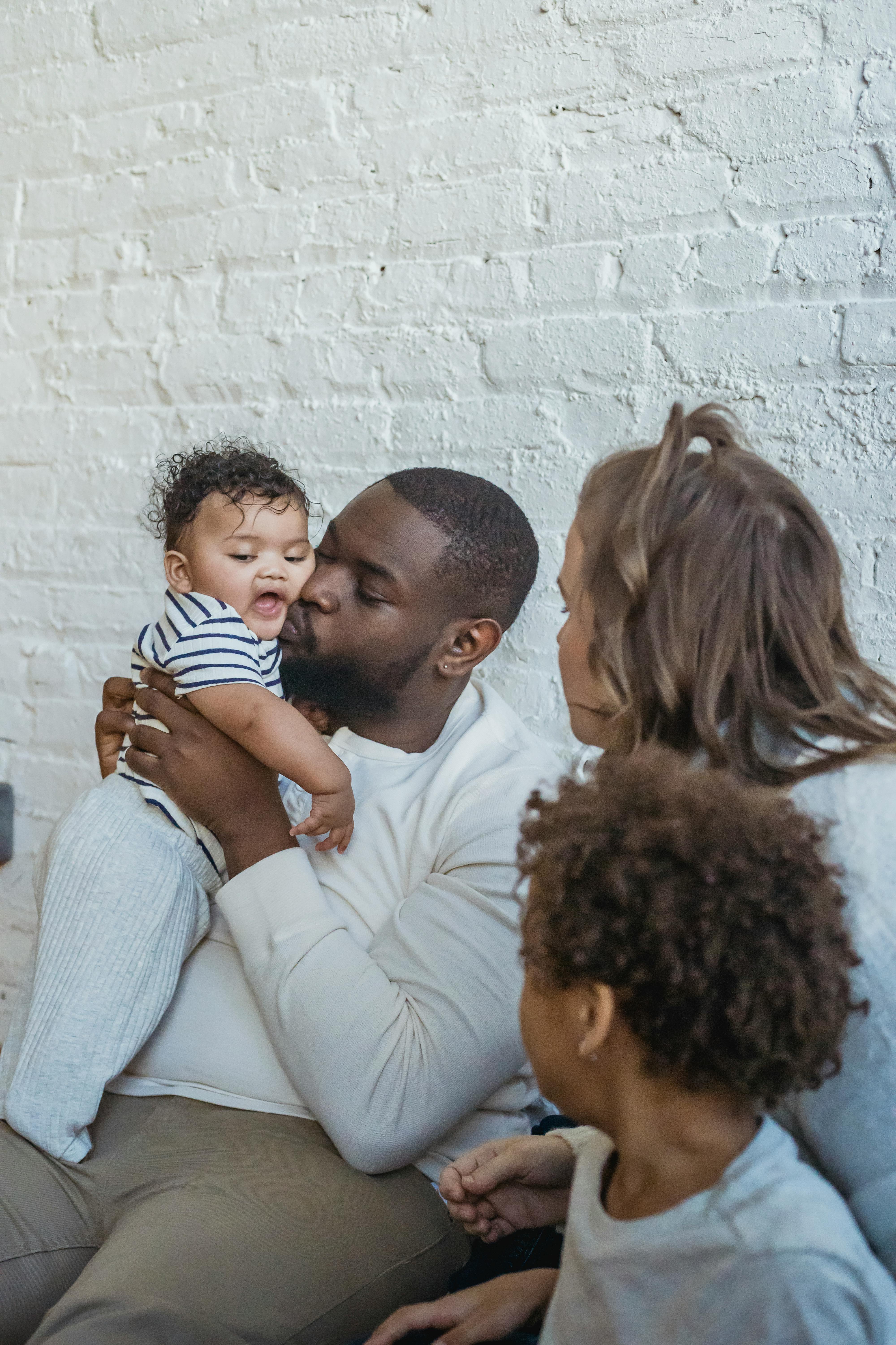 multiethnic family sitting together in studio