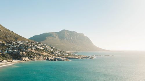 Free A breathtaking aerial view of Cape Town's coastline with clear skies and mountains. Stock Photo