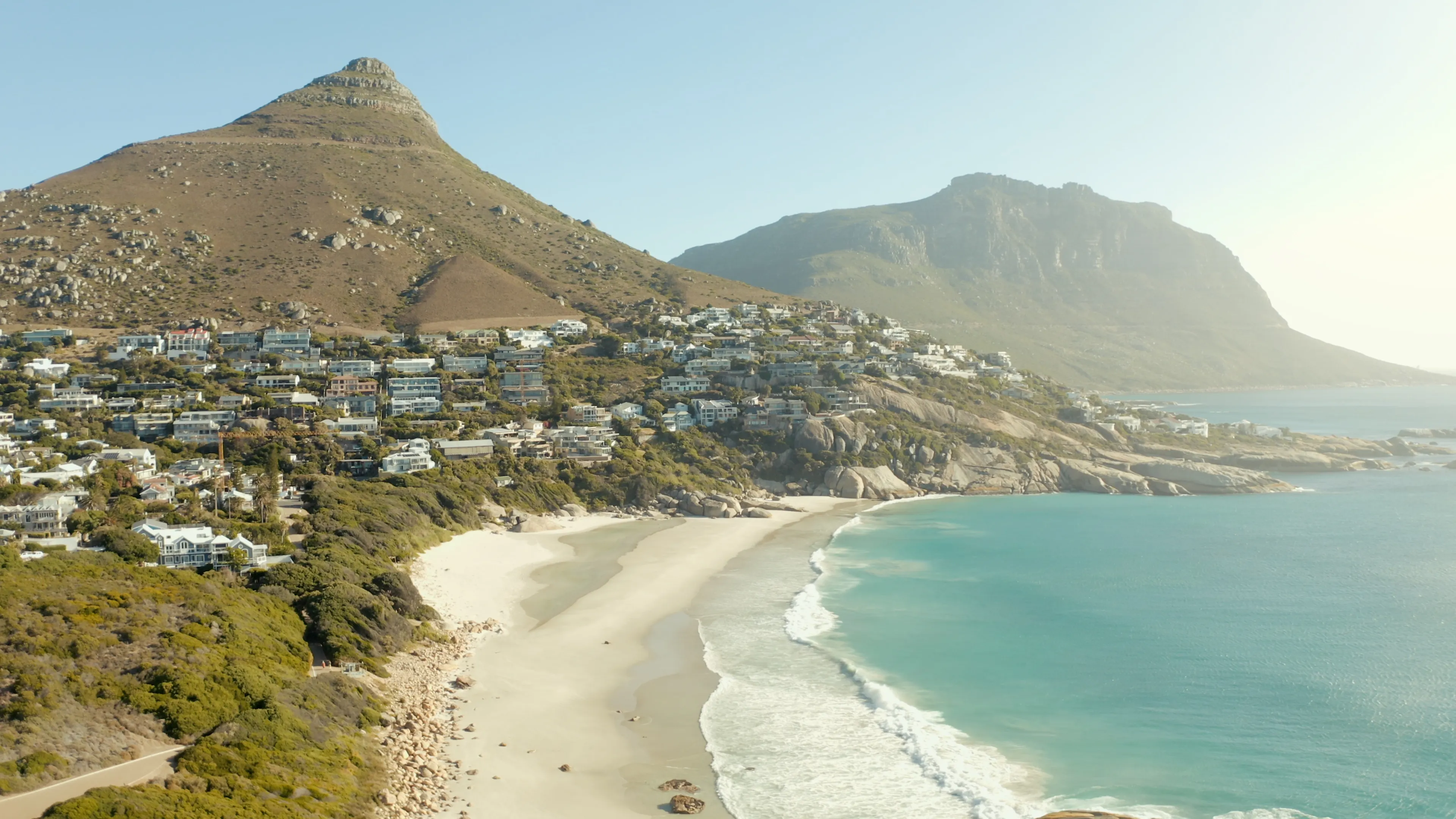 Aerial view of Lion's Head rising above Camps Bay and the Atlantic coastline in Cape Town