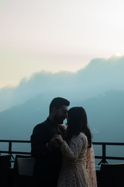 A romantic couple dancing together in Kasauli, India, with beautiful mountain views.