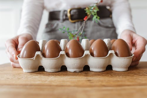 Free Brown Eggs on White Egg Tray Stock Photo