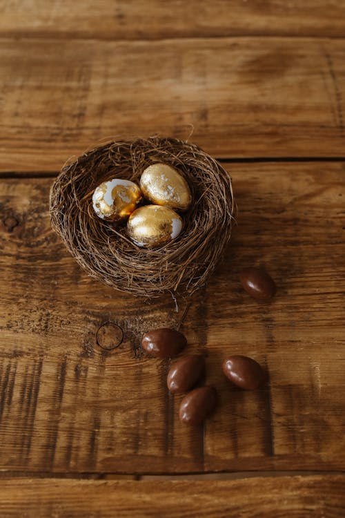 Free White and Gold Eggs on a Nest  Stock Photo