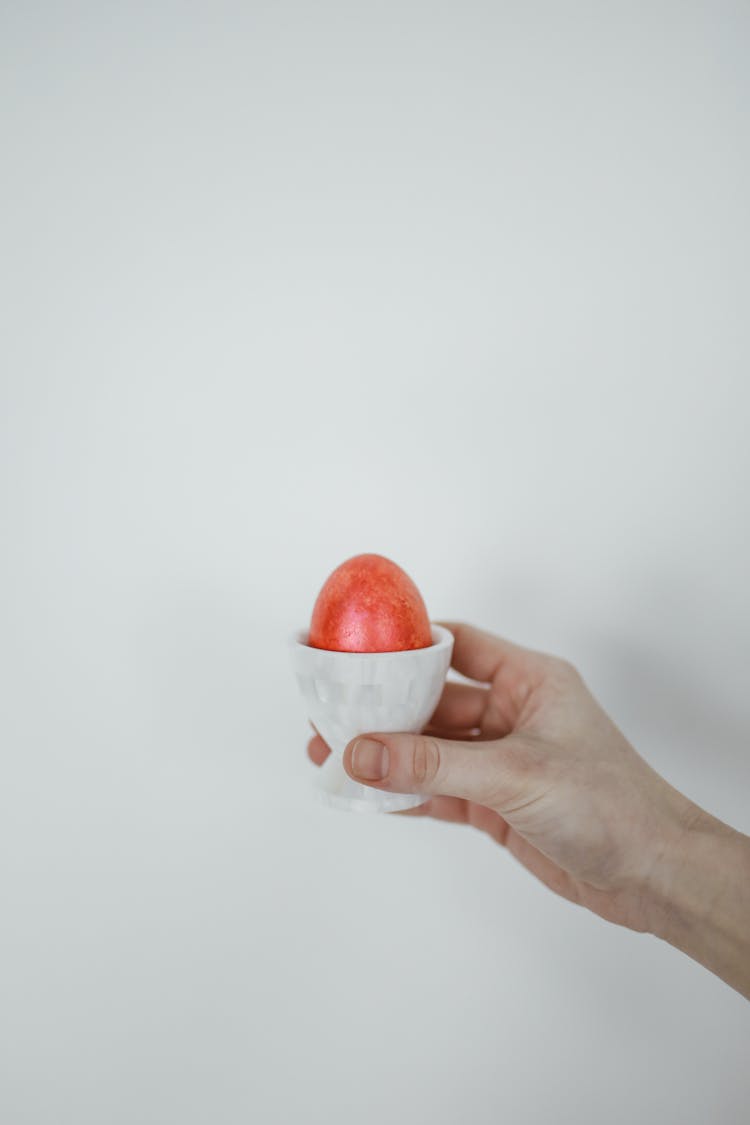 Colored Egg On Porcelain Egg Cup 