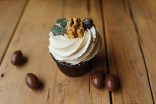 Cupcake with Icing and Walnut