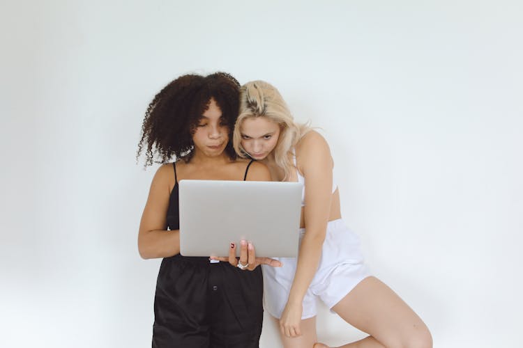 Women Looking At A Laptop Screen