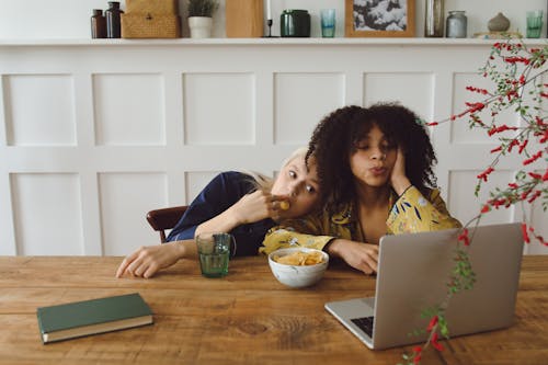 Free Women looking at a Gray Laptop  Stock Photo