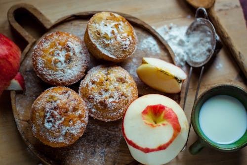 Sweet dessert with fresh apples on wooden board