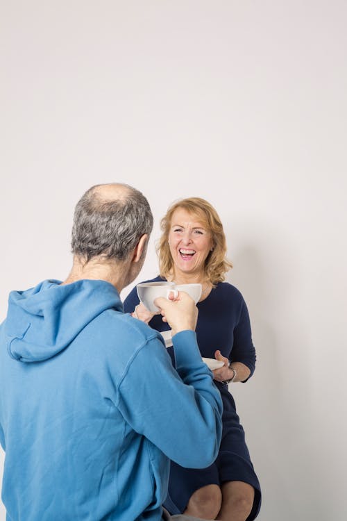 Free Couple Holding Cup of Coffee Stock Photo