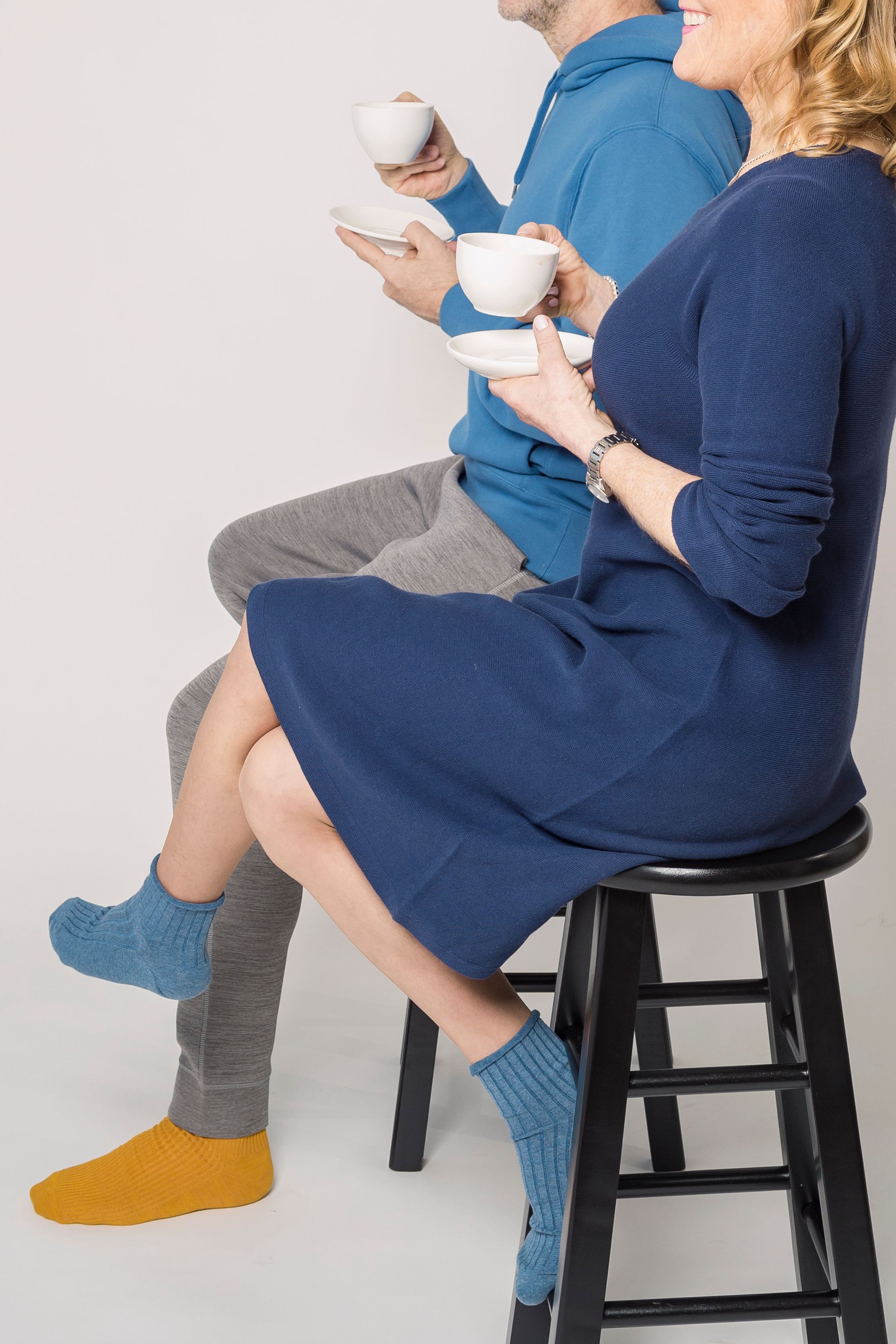Woman in Blue Long Sleeve Dress Sitting on Black Chair · Free Stock Photo