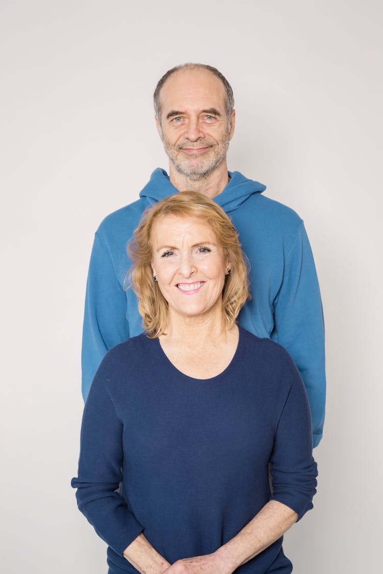 Man In Blue Jacket And Woman In Blue Shirt