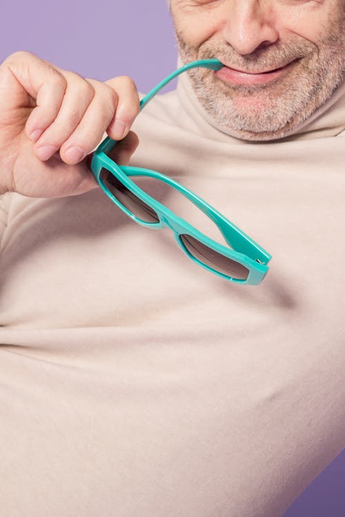 Man Biting His Sunglasses