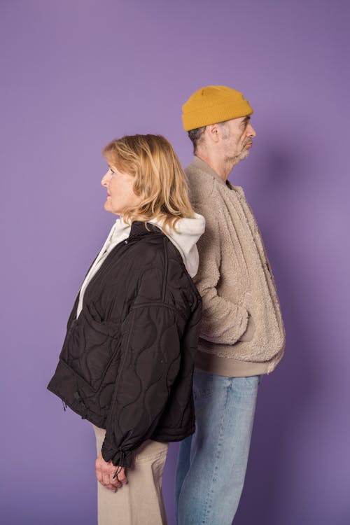 Woman in Black Zip Up Jacket Beside Man in Brown Jacket