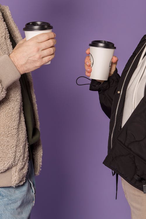 Couple Holding Cup of Coffee