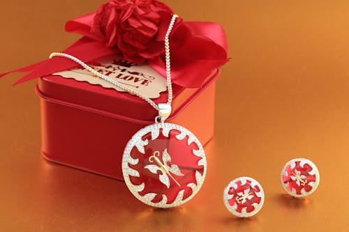 Close-up Photo of Red Gift Box with Jewelries 