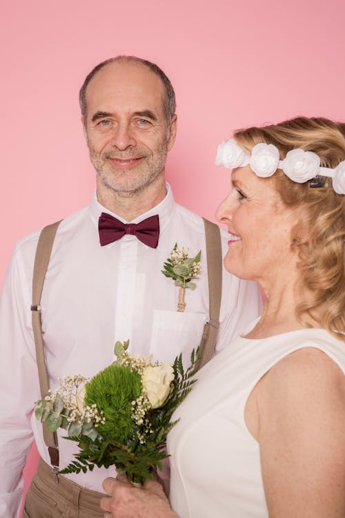 Man in White Dress Shirt with Woman in White Dress