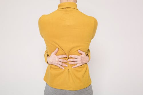 Man in Yellow Turtleneck Sweater and Gray Denim Jeans