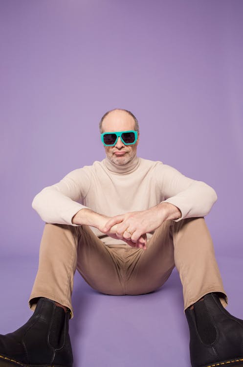 Man in Beige Turtleneck Sweater Wearing Green Sunglasses