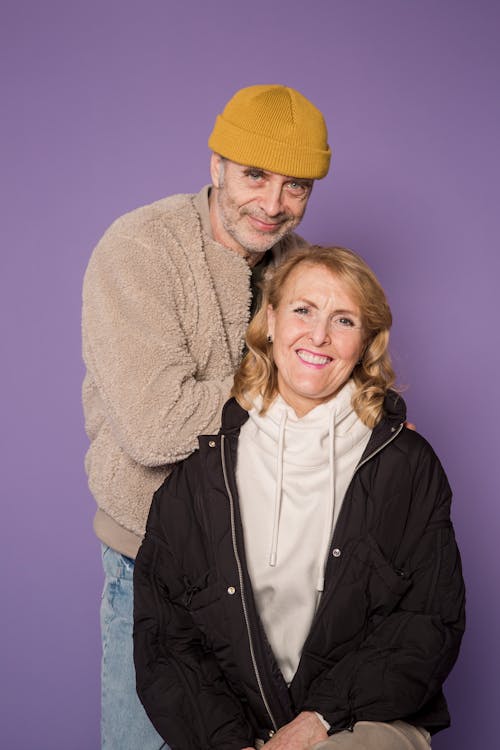 Woman in Black Zip Up Jacket Beside Man in Brown Jacket