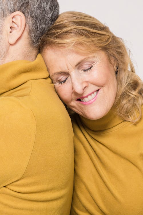 Woman in Yellow Sweater Smiling