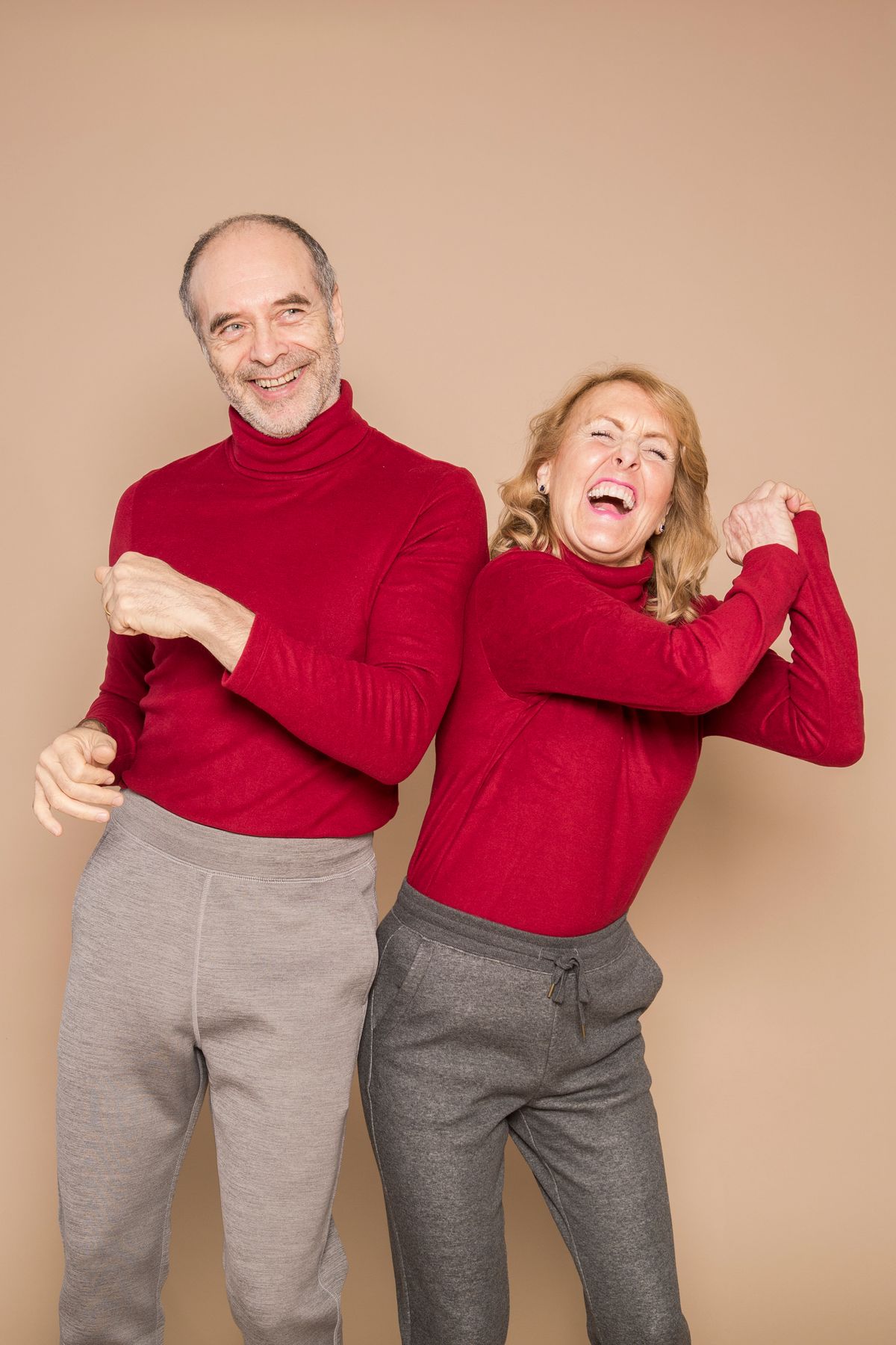 A happy senior couple dancing together, enjoying active later life