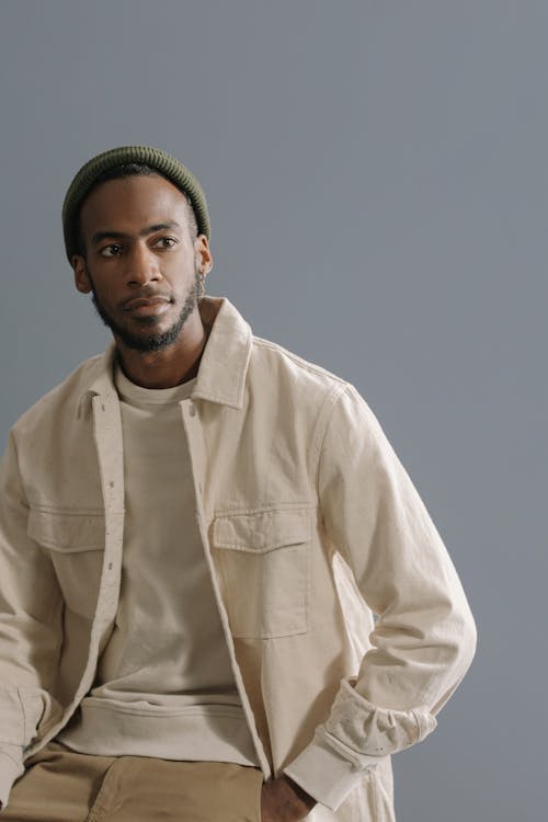 Photograph of a Man in a Cream Shirt Posing