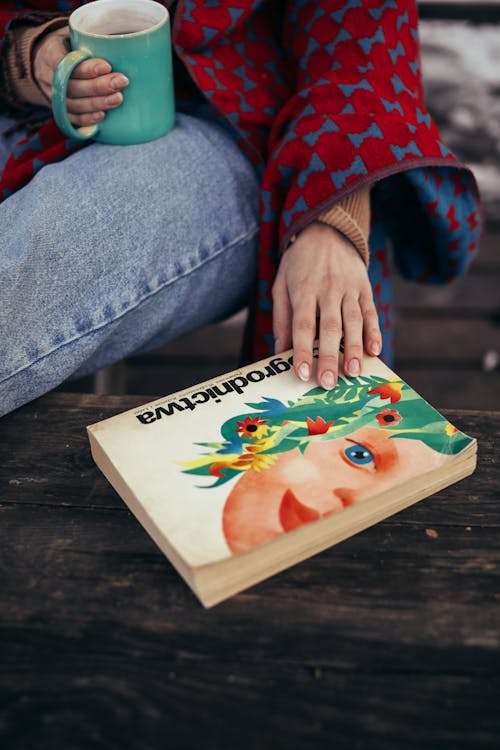 Free Hand on a Book  Stock Photo