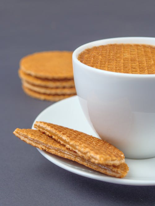 
A Close-Up Shot of a Cup and Stroopwafel Cookies