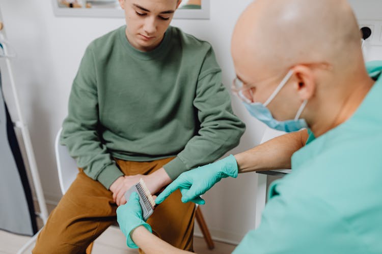 Dentist Having A Discussion With A Patient