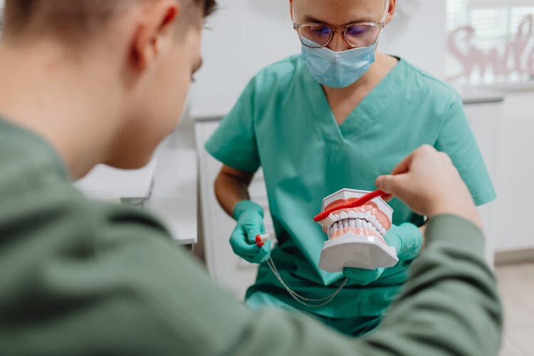 Dentist Having A Discussion With A Patient