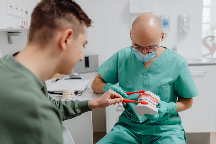 Dentist Having A Discussion With A Patient