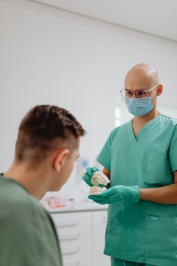 Dentist Having A Discussion With A Patient