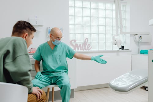 Dentist showing a Dental Chair