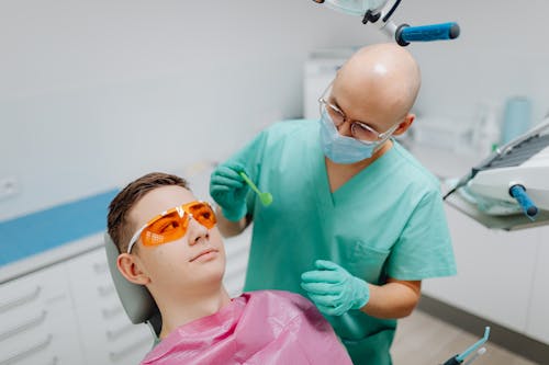 Dentist looking at Patient's Teeth