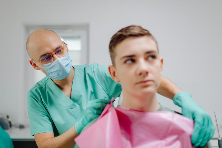 Dentist Having An Appointment With A Patient