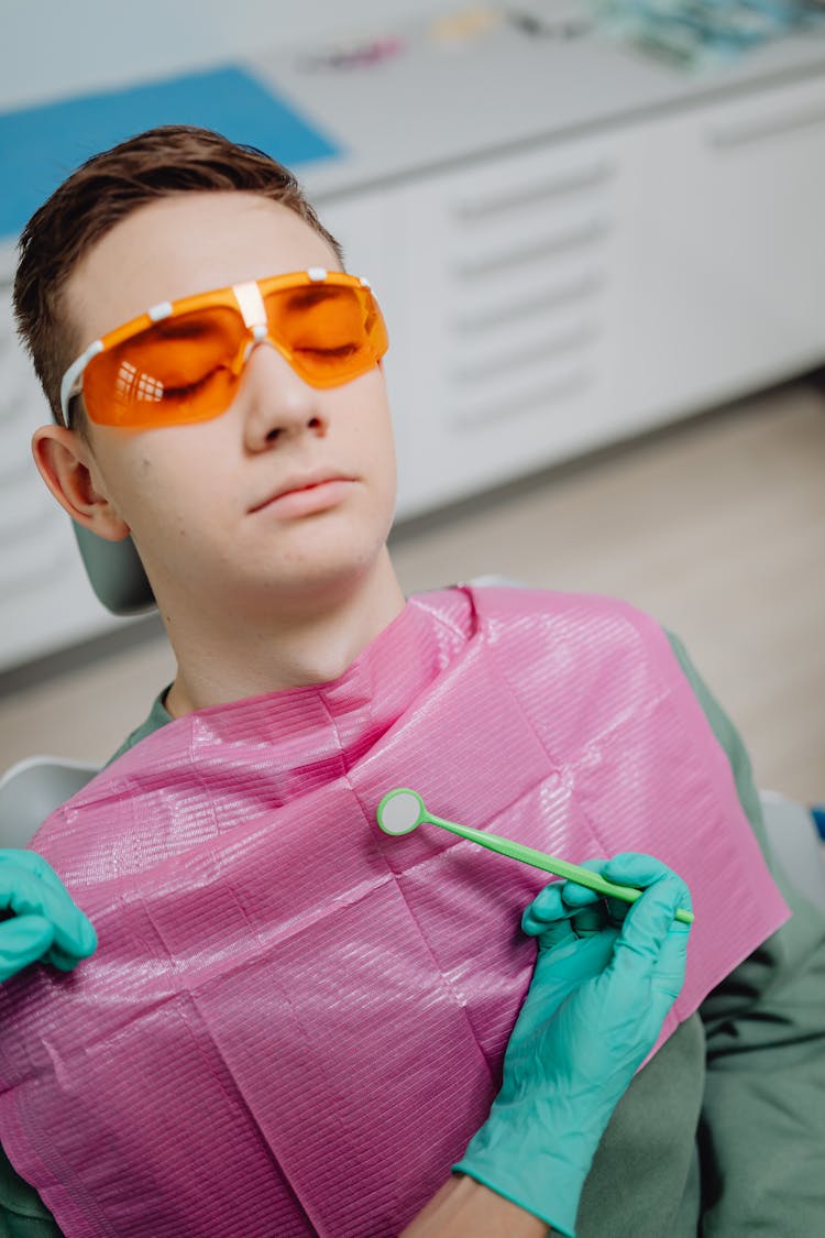 Man In Dentist Office During Procedure