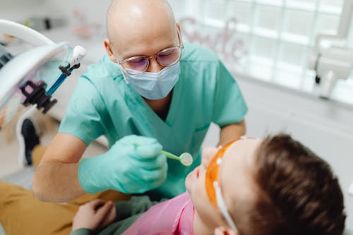 Kostnadsfri bild av kirurgisk handske, kirurgisk mask, patient