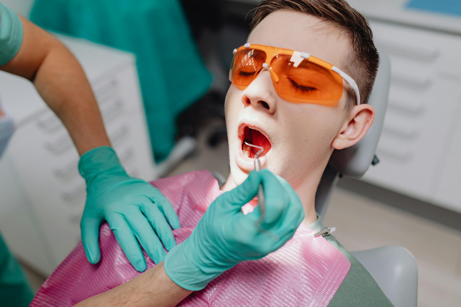 A Man with Open Mouth at Dental Clinic