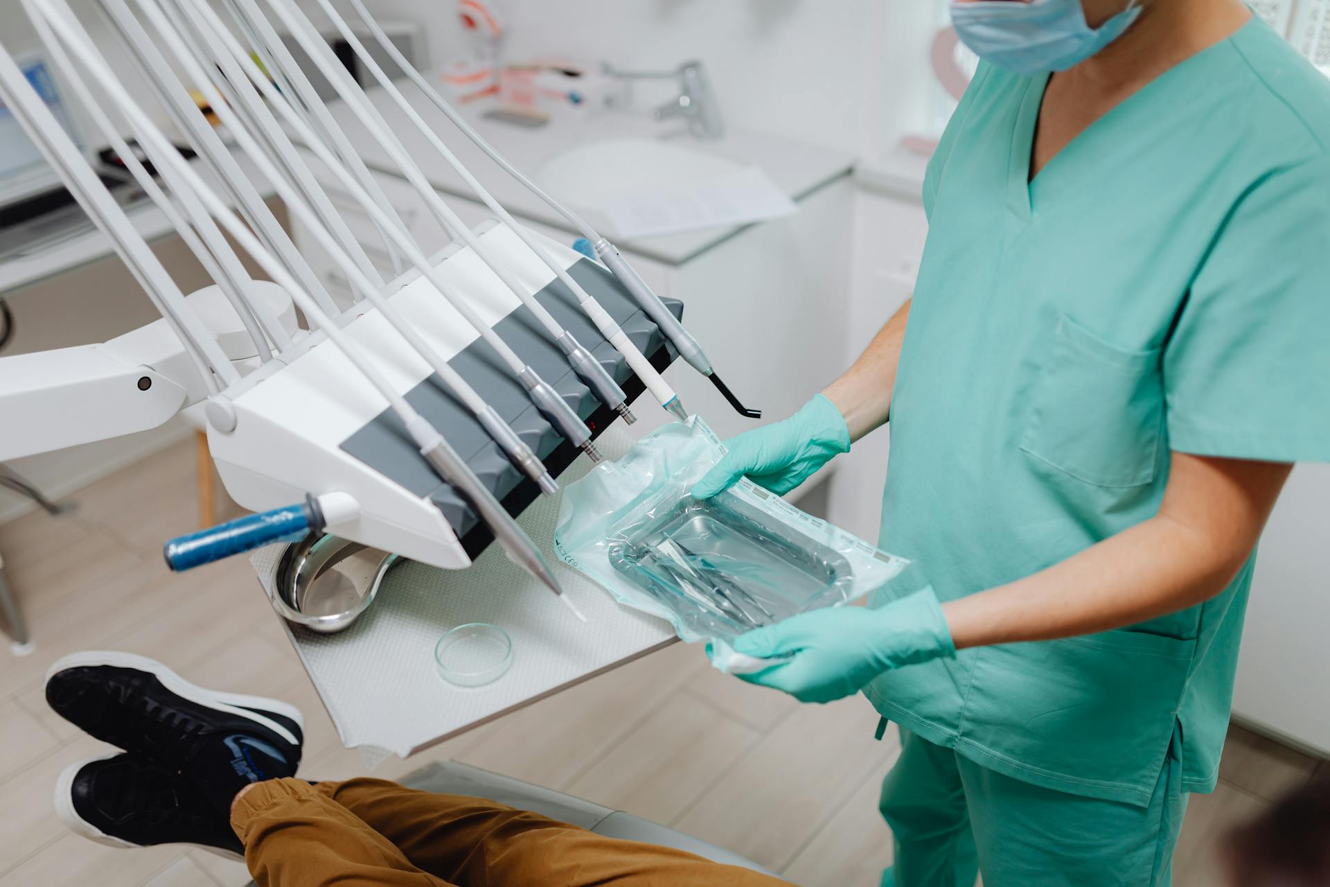 A Medical Professional Holding a Pack of Sterilized Medical Instruments