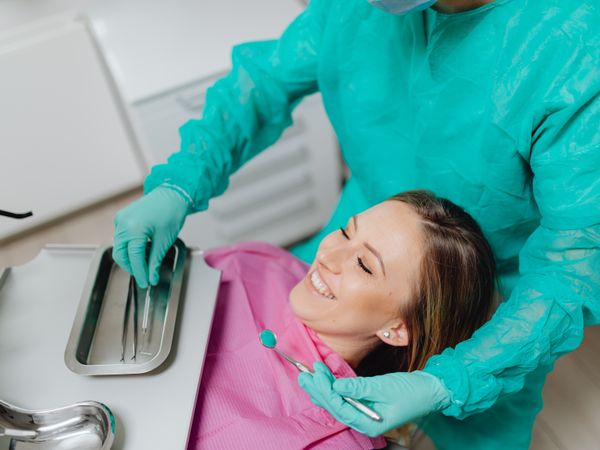 Happy patient in dental chair at Smile Point Multi Speciality Dental Clinic