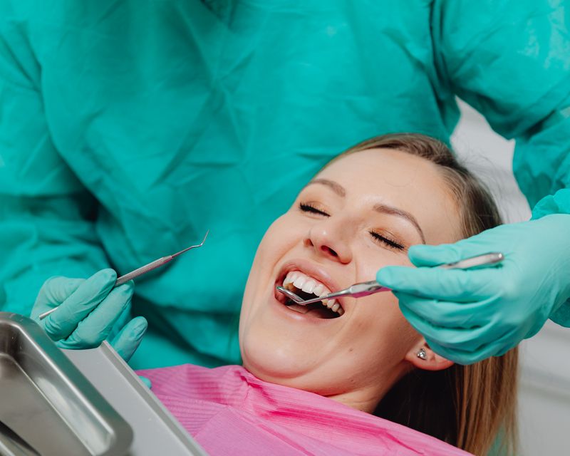 A patient resting comfortably in a dental chair before treatment