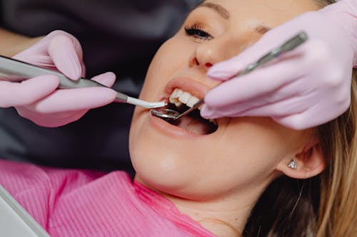 Free Photo of a Woman Getting a Dental Check Up Stock Photo