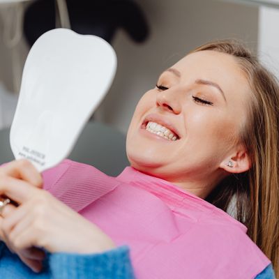 Smiling patient in a dentist chair