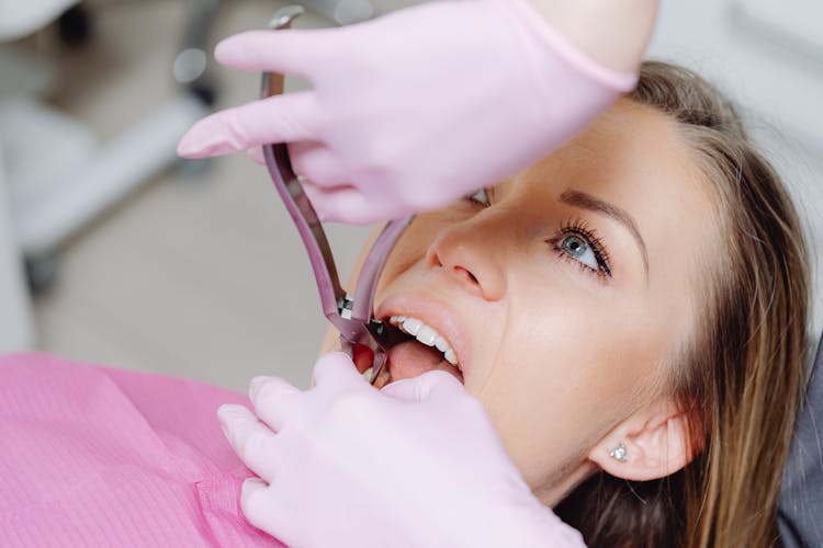 Woman During Dentist Treatment